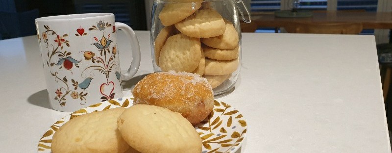 biscuits next to cup of coffee
